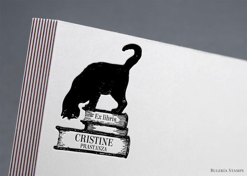 book library stamp with a cat on bookstack